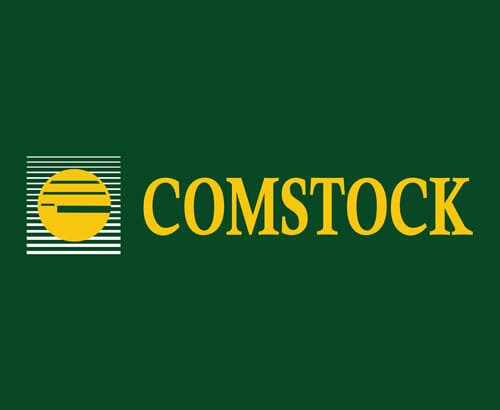 Comstock Construction's dark green and gold logo with icon on matching green background with the word "Comstock" beside