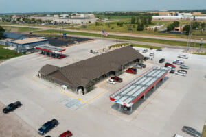 Aerial view of the roof the the Cenex C-Store and pump stations surrounded by concrete parking lot.